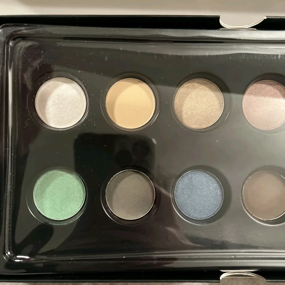 OFRA Eyeshadow Palette with Green, Blue, and Gold Hues